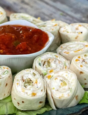 tortilla roll-ups with salsa for serving