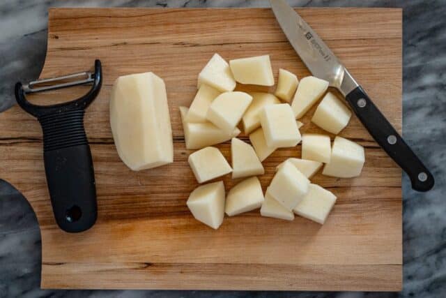 Diced potatoes on a cutting board.