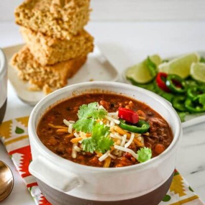 chili in a bowl with garnishes