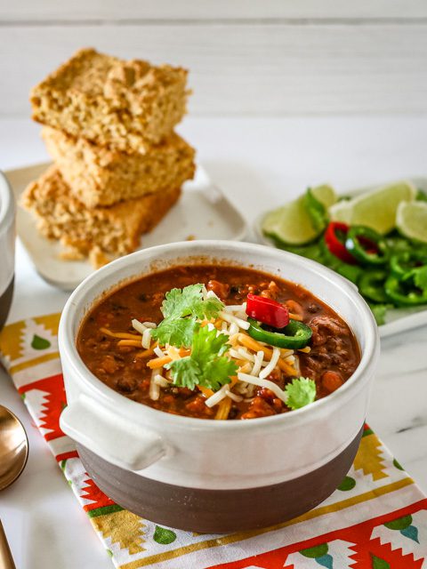 chili in a bowl with garnishes