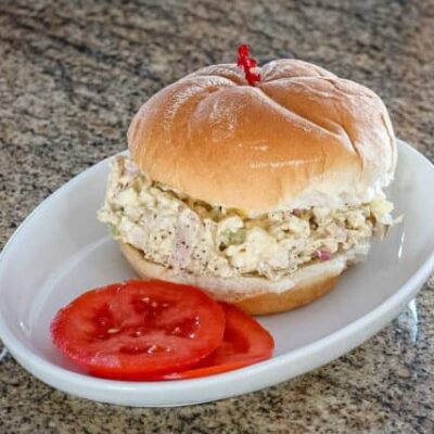 turkey and egg salad sandwich on a soft bun