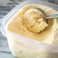 vanilla ice cream in a container with scoop