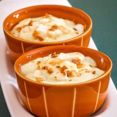vanilla pudding with toasted coconut flakes