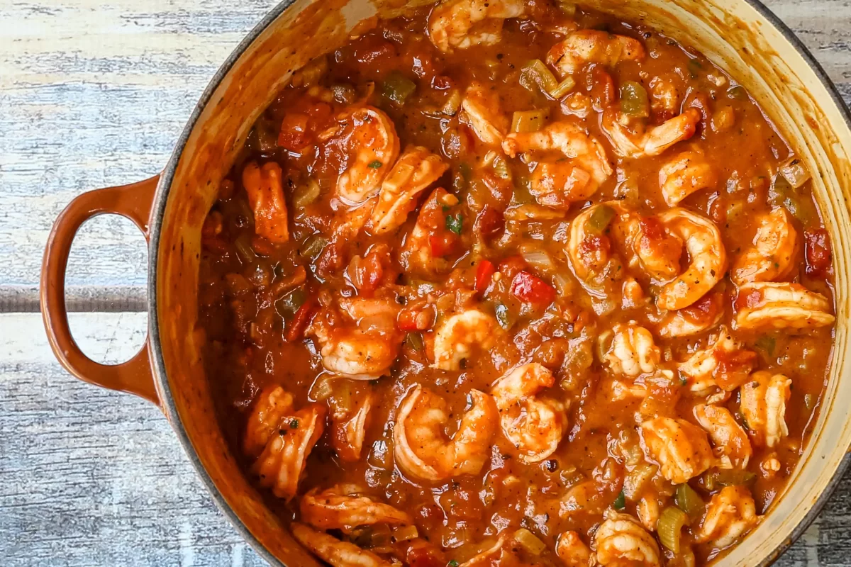Savory shrimp and vegetable stew in a pot with tomato sauce.
